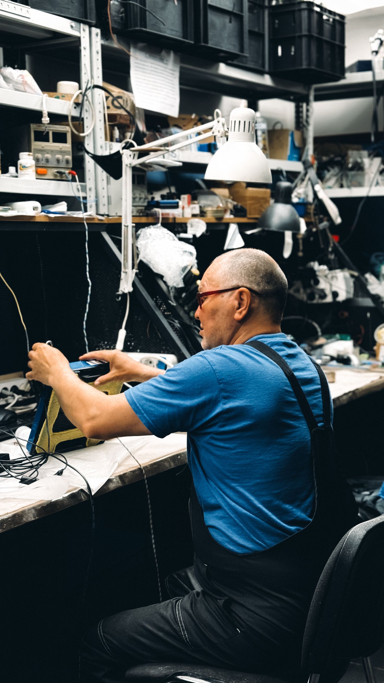 Portrait of a licensed electrician on the job wiring a panel